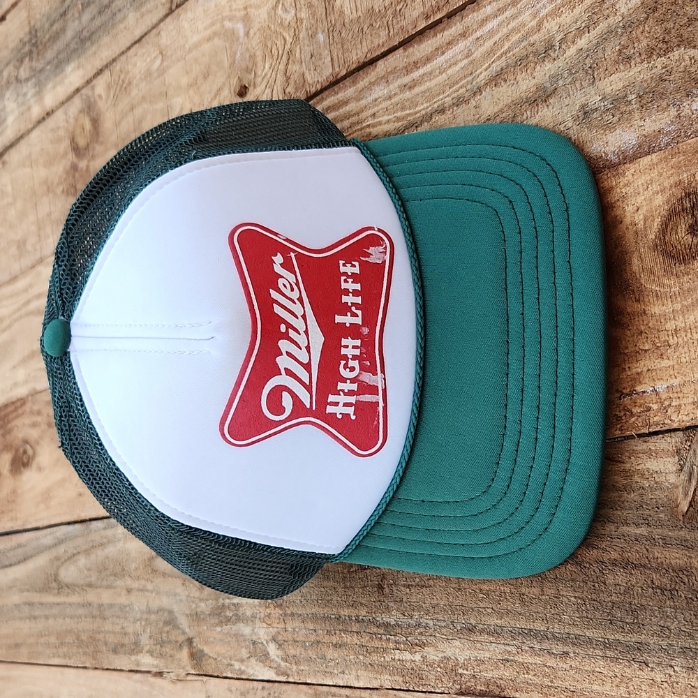 American Needle green and white trucker hat